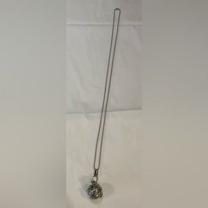 14” Sterling Silver round ball locket. With a clasp to open it.